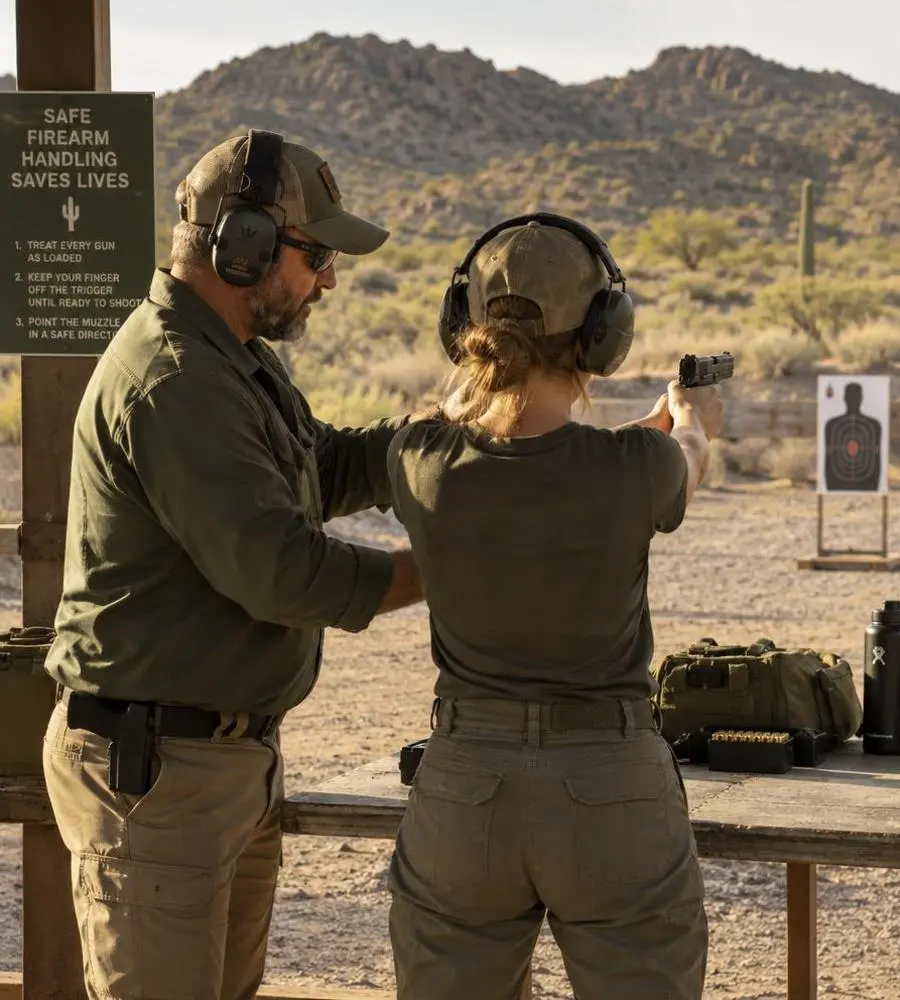 Safety and training — Bisbee Guns Instructor teaching a new owner the basics of safe firearm handling